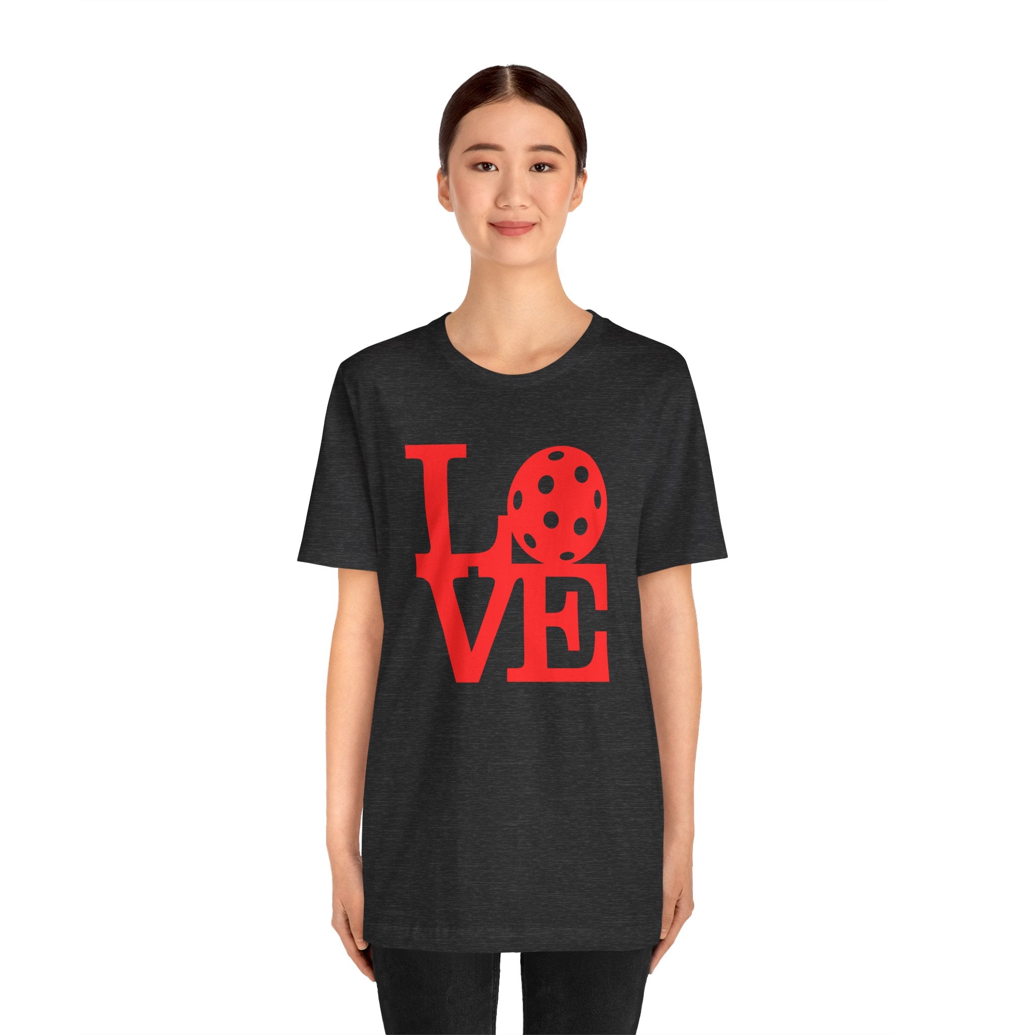 Red LOVE Pickleball graphic T-shirt by Printify featuring bold pop art design, casual fit, perfect for pickleball enthusiasts.
