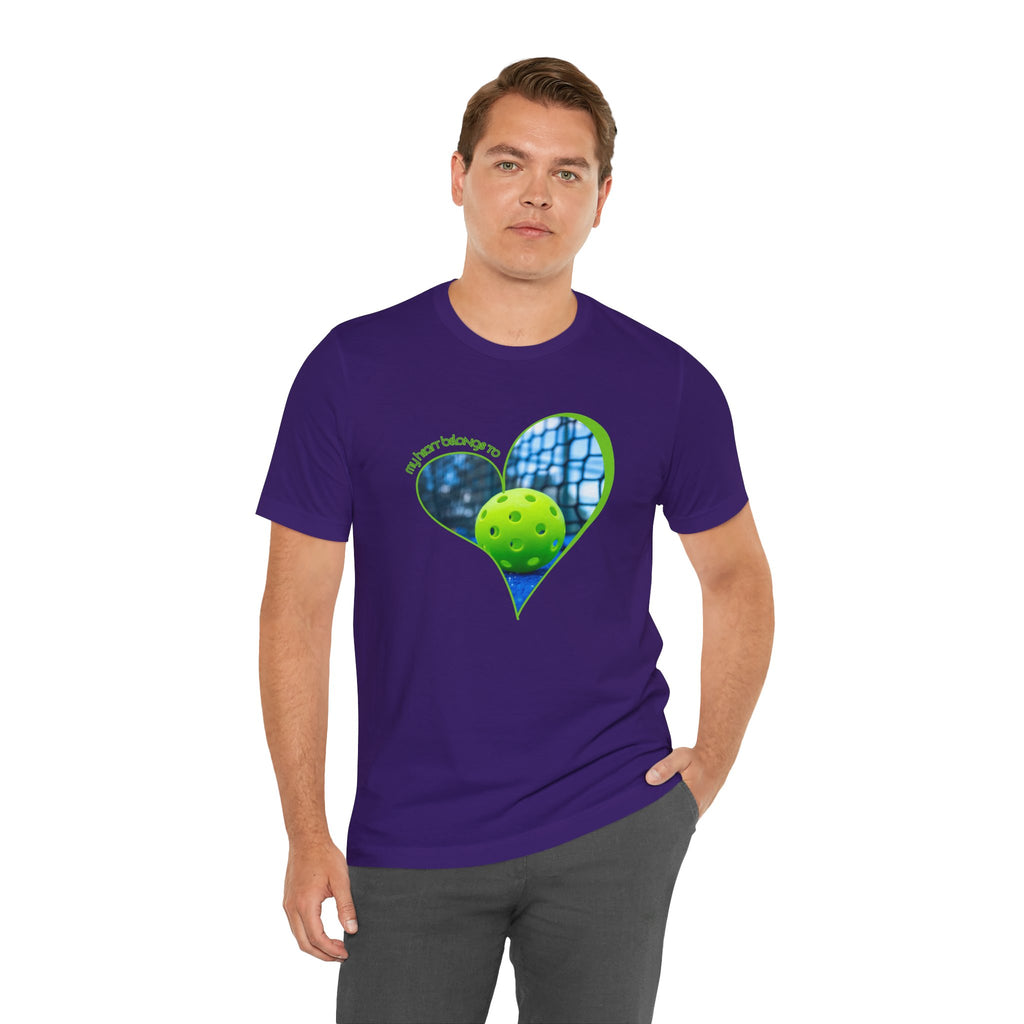 White pickleball t-shirt with "My Heart Belongs to Pickleball" slogan for players and fans, by Printify.