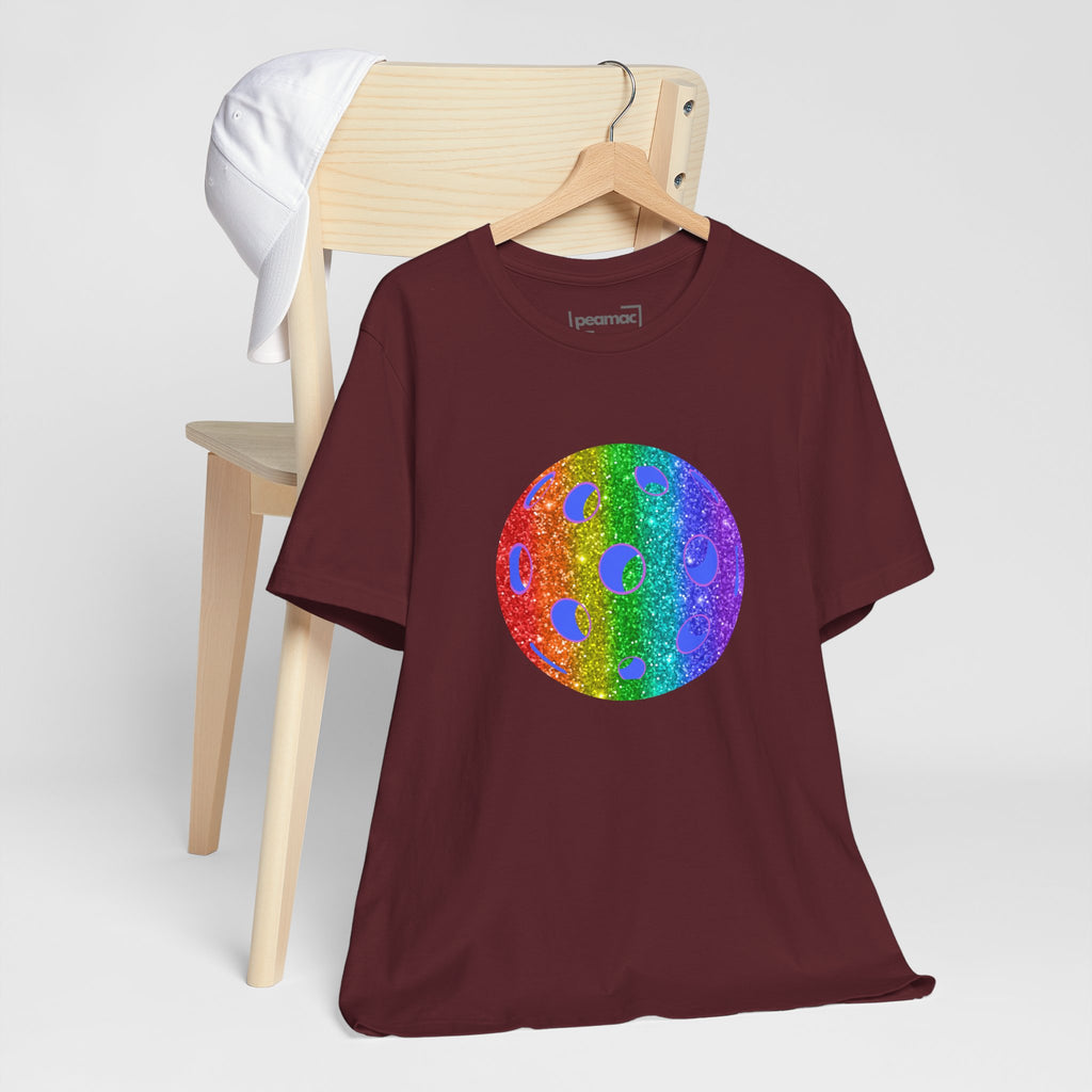 Rainbow glitter pickleball pride T-shirt by Printify featuring a colorful, sparkly design celebrating LGBTQ+ pride and pickleball.