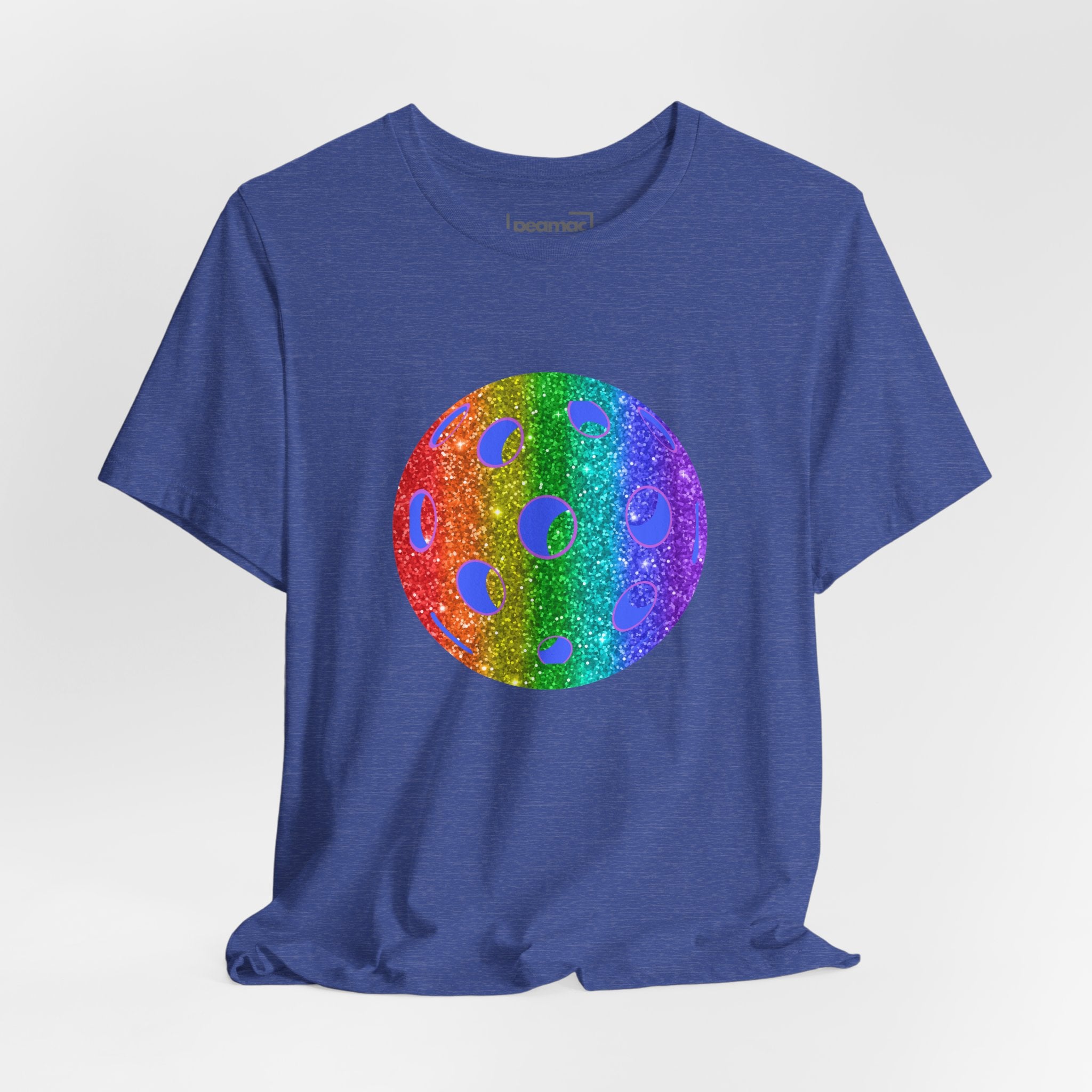 Rainbow glitter pickleball pride T-shirt with "Sparkle Loud and Proud" text, featuring colorful pickleball graphics on a white shirt.