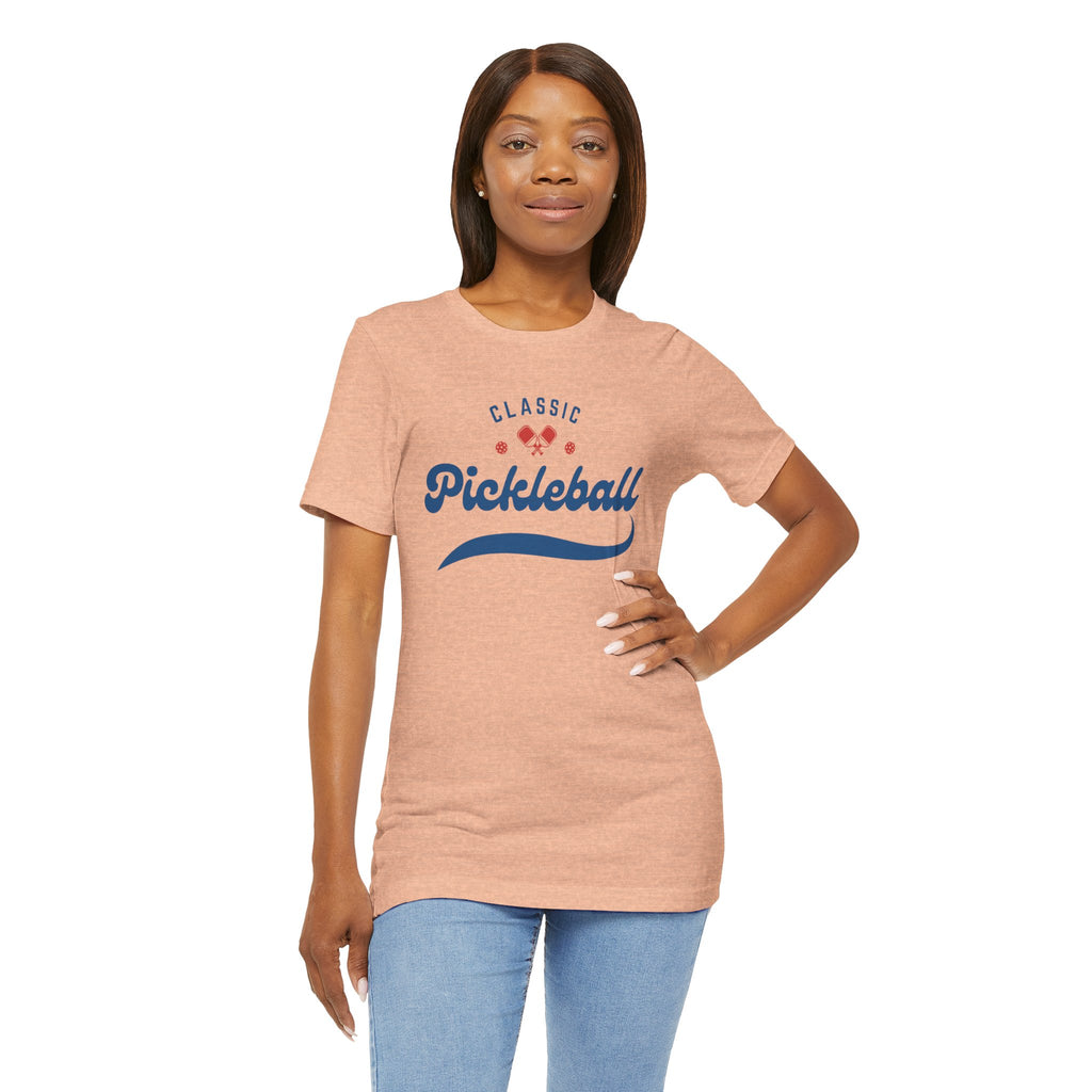 Red and blue pickleball T-shirt with script logo, paddle, and ball design, made by Printify.