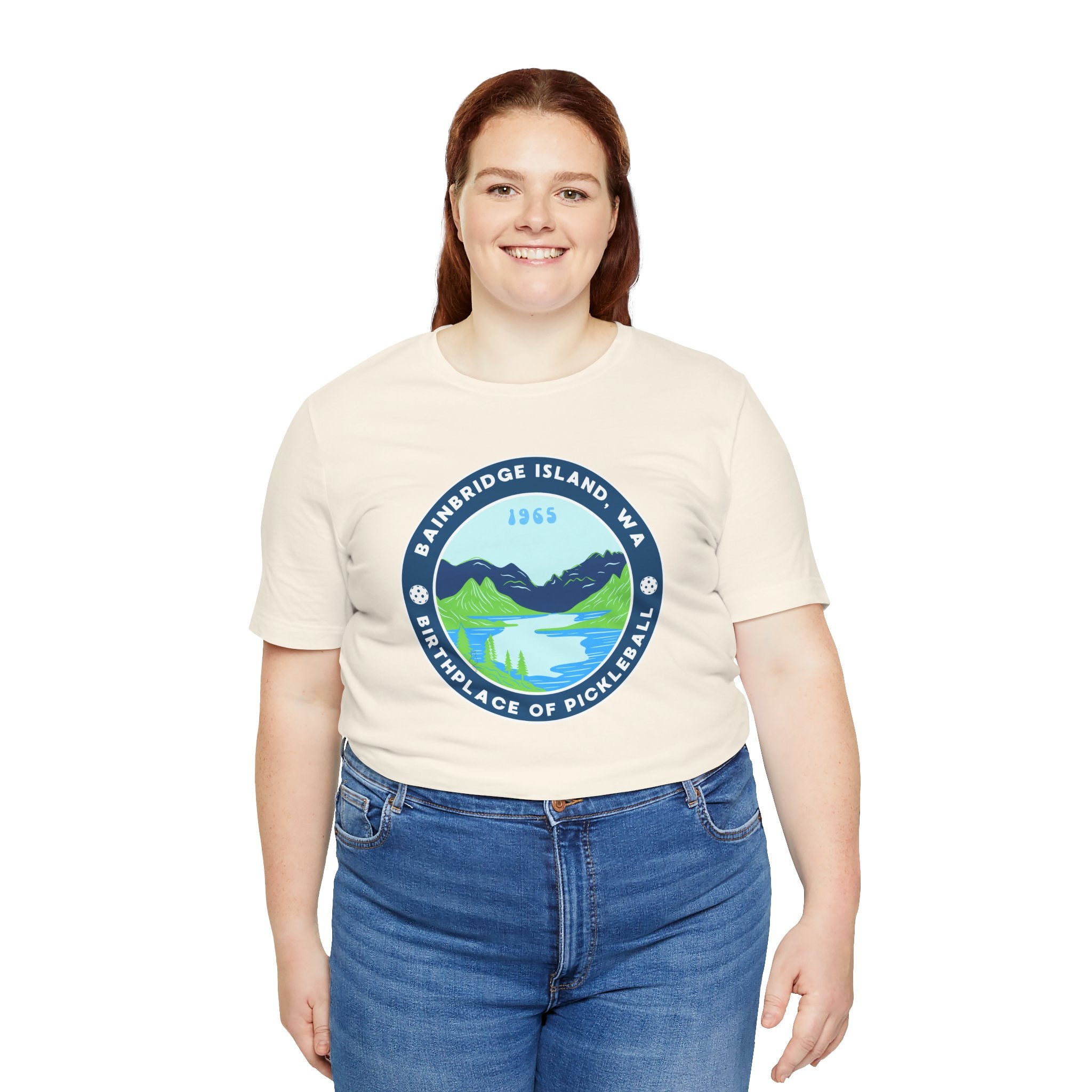 Unisex Bainbridge Island Pickleball T-Shirt featuring the "Birthplace of Pickleball 1965" design in black on a white fabric.