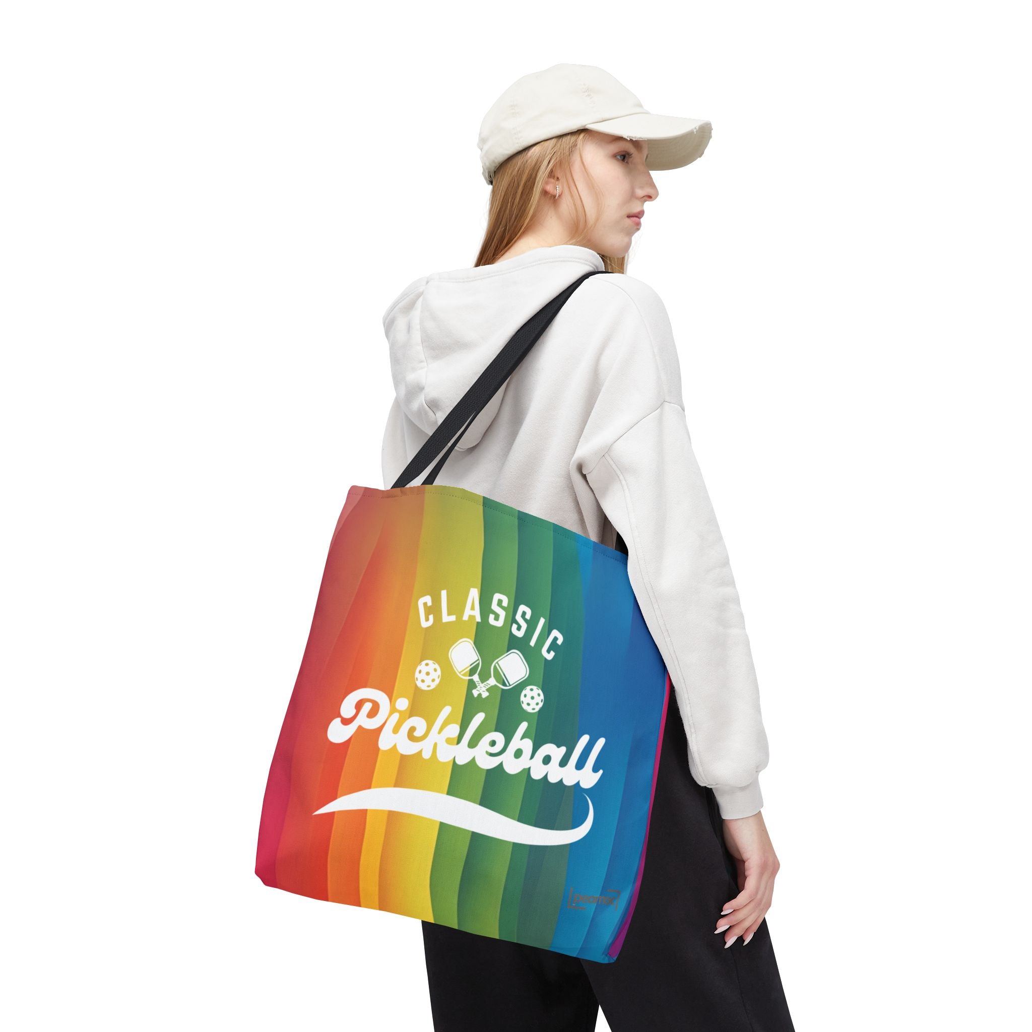 Colorful rainbow tote bag with crossed pickleball paddles and script design, ideal for carrying sports gear and everyday essentials.