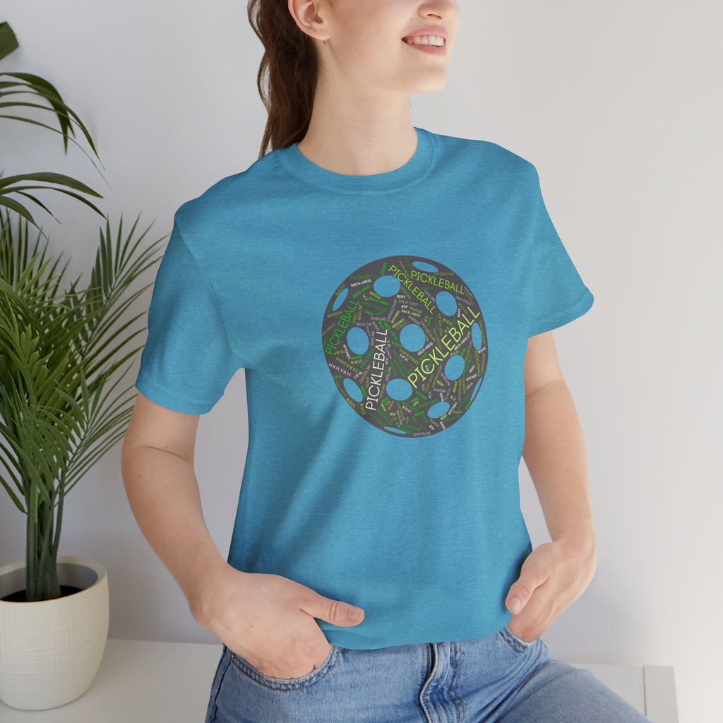 Pickleball Word Cloud T-Shirt with pickleball-shaped graphic, featuring words like dink, pickle, and kitchen in bold print.