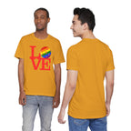 Love Pickleball Pride T-shirt featuring rainbow LGBTQ2 flag design, casual unisex cotton tee for Pride celebrations.