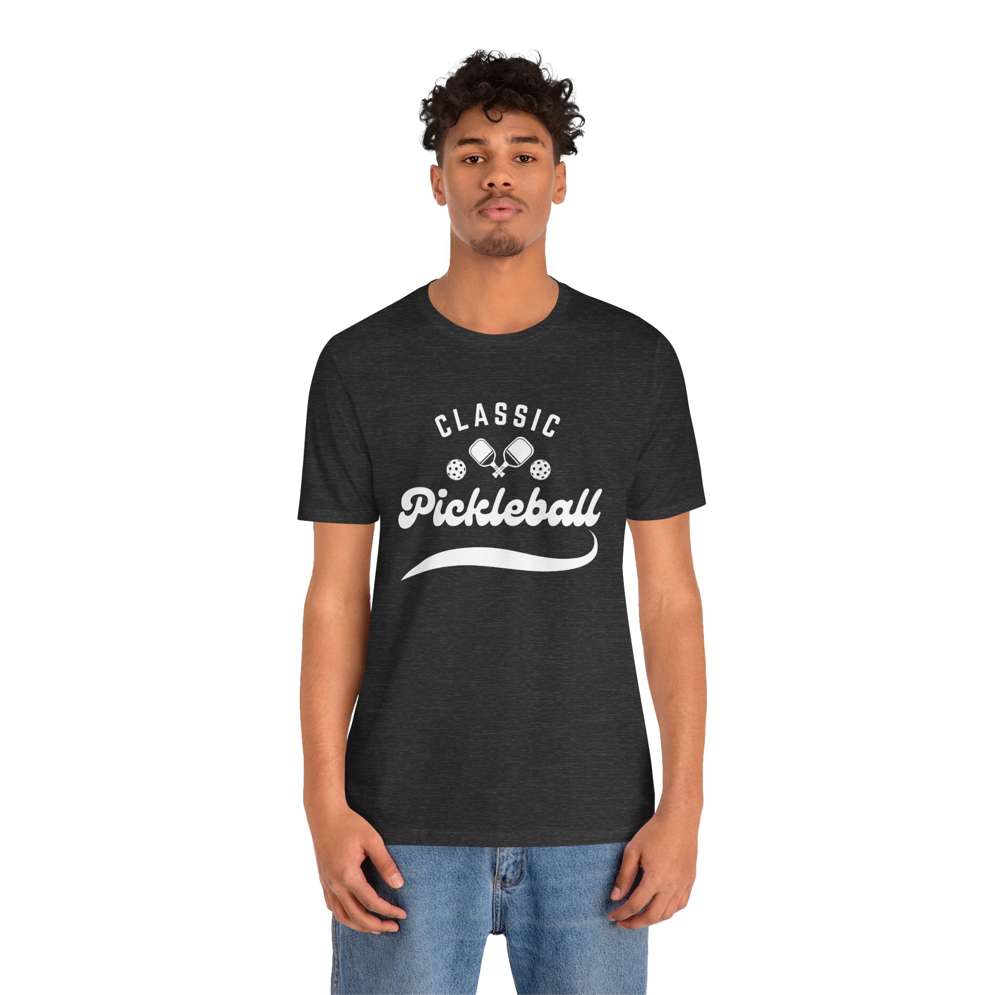 White pickleball T-shirt with "Pickleball" script design, lightweight cotton, casual fit, by Printify.