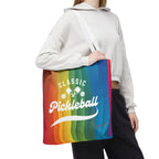 Colorful Pickleball Classic Rainbow Tote Bag with crossed paddles script design, durable fabric, and spacious interior for sports gear.