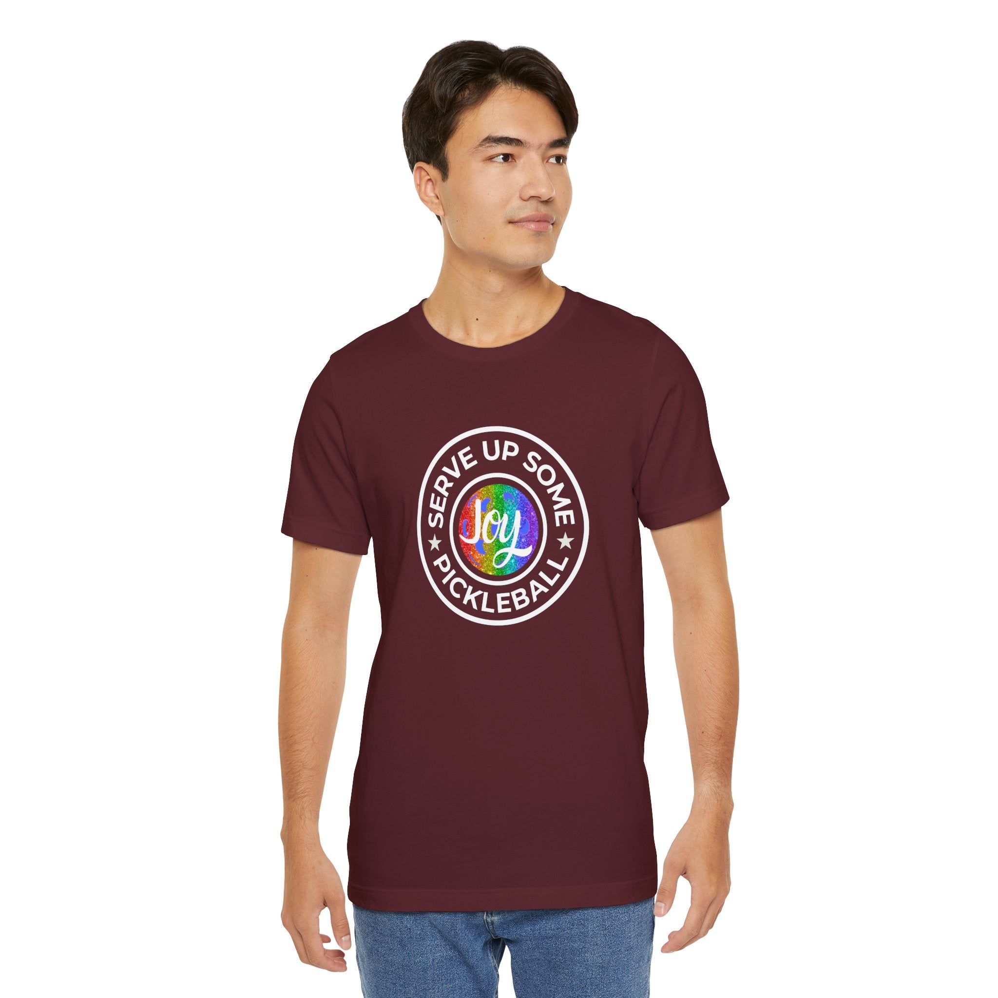 LGBTQ2 pride pickleball T-shirt by Printify featuring a colorful rainbow design and playful pickleball graphics.