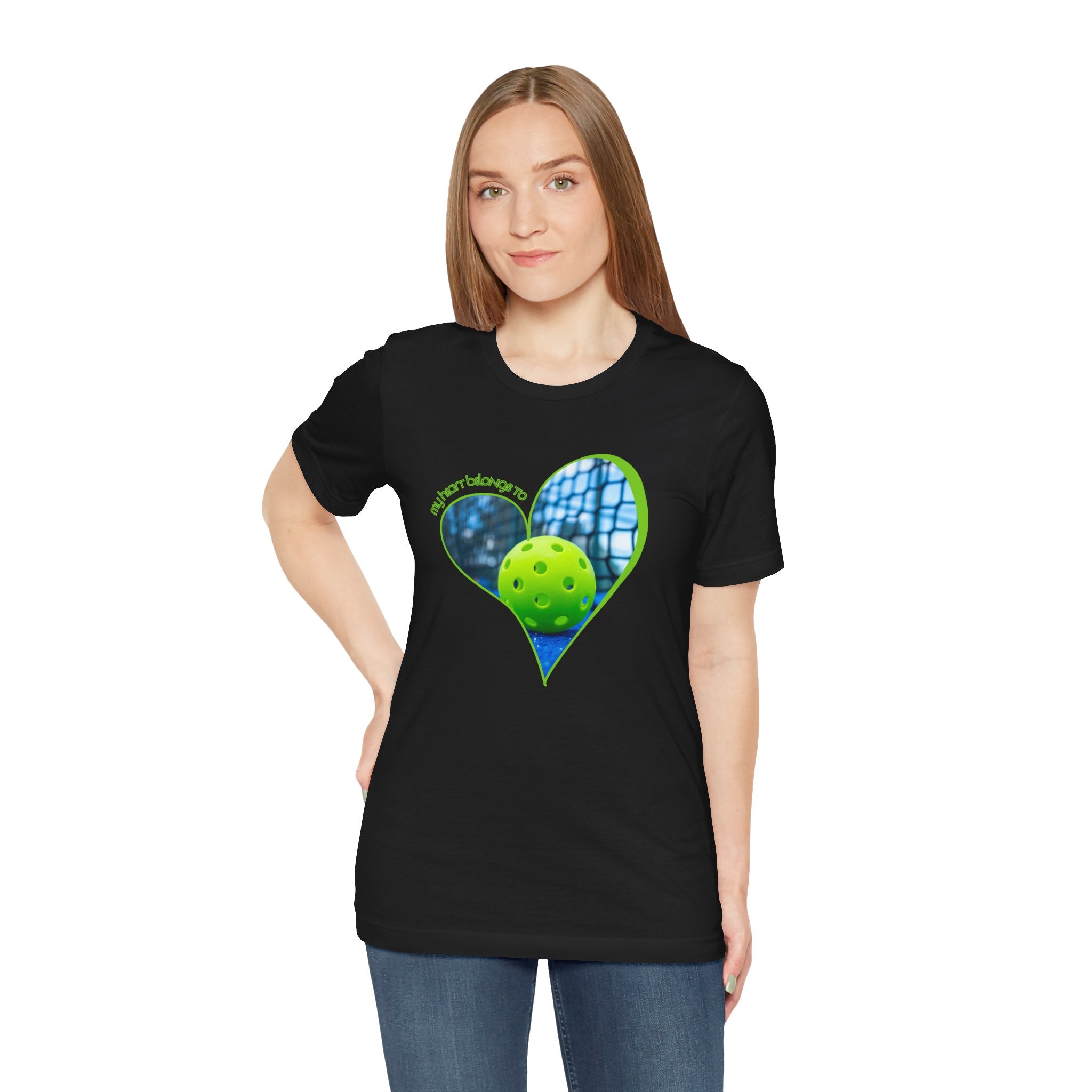 White pickleball T-shirt with "My Heart Belongs to Pickleball" print, designed for players and fans, by Printify.
