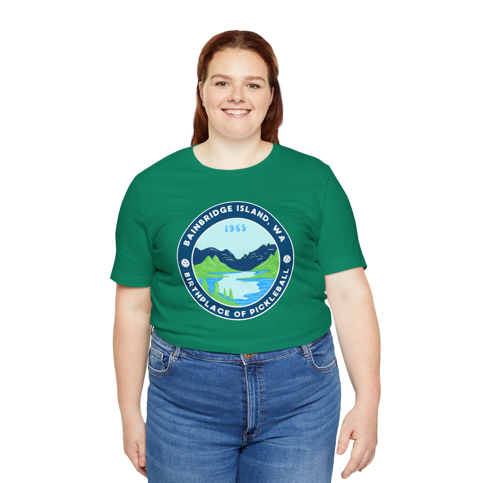 Unisex Bainbridge Island Pickleball T-Shirt with "Birthplace of Pickleball 1965" graphic, white fabric, casual style.