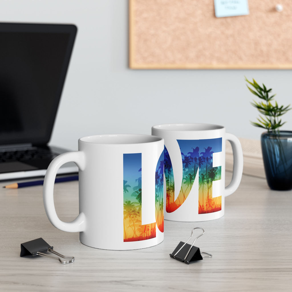Love Rainbow Pride ceramic mug with vibrant tropical LGBTQ+ rainbow design, available in 11oz and 15oz sizes.