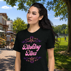 Pink Dinking Diva Pickleball T-Shirt by PeaMac Pickleball Tees featuring a stylish filigree design and athletic fit, shown against a park backdrop.