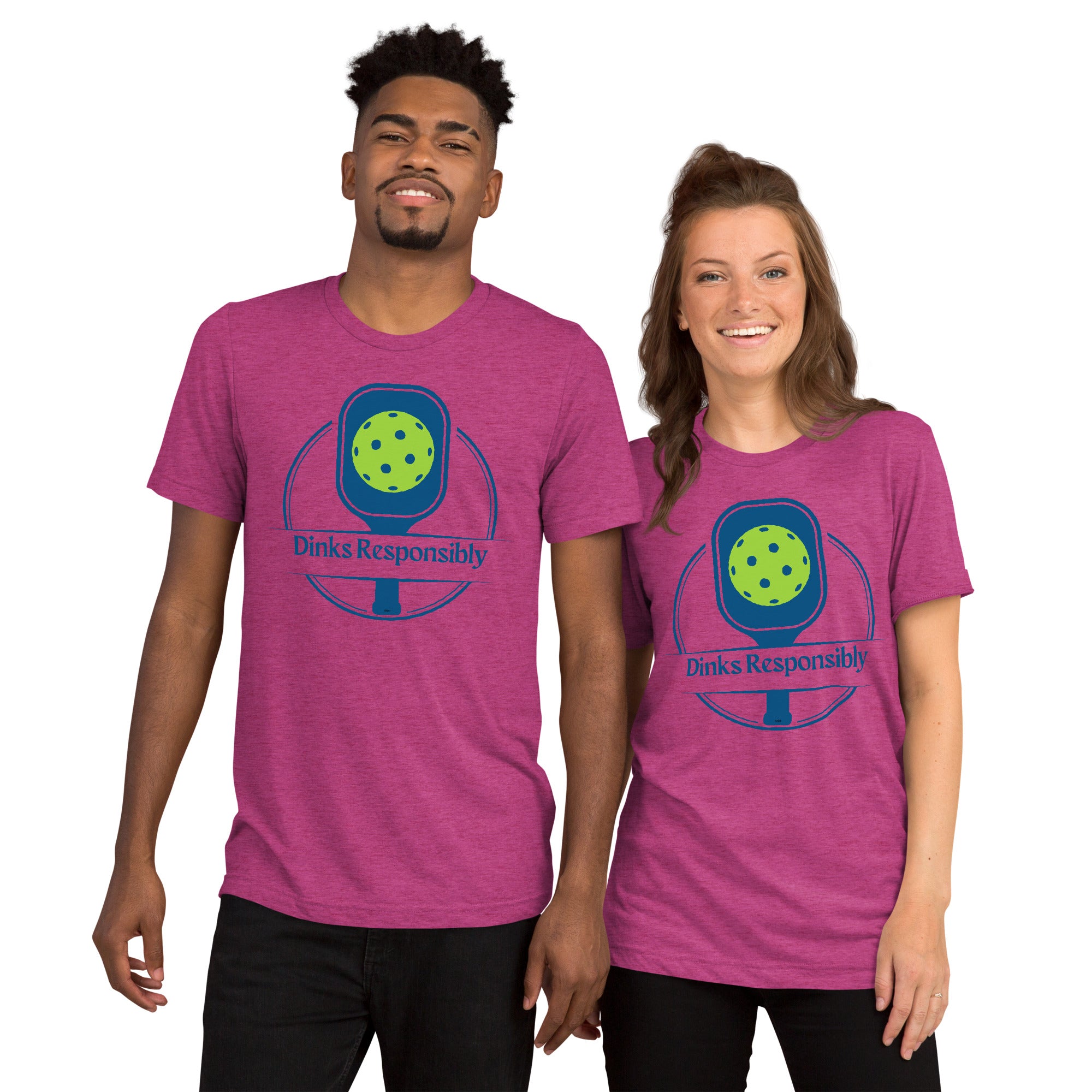 Unisex berry-colored tri-blend pickleball T-shirt with graphic of paddle and ball, featuring humorous "Dinks Responsibly" slogan.
