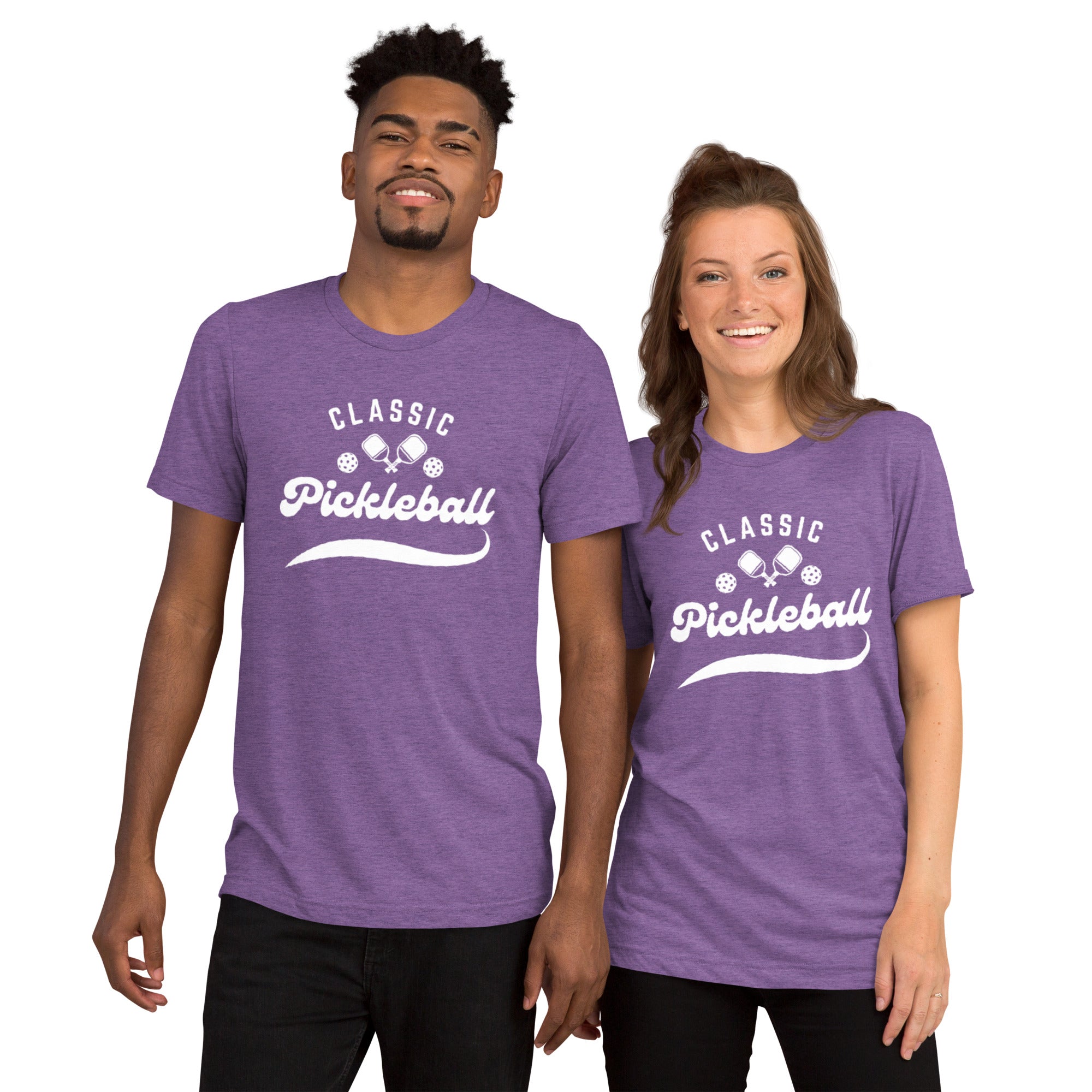 White Classic Pickleball Script T-Shirt by PeaMac Pickleball Tees, unisex tri-blend fabric, front view with purple background.