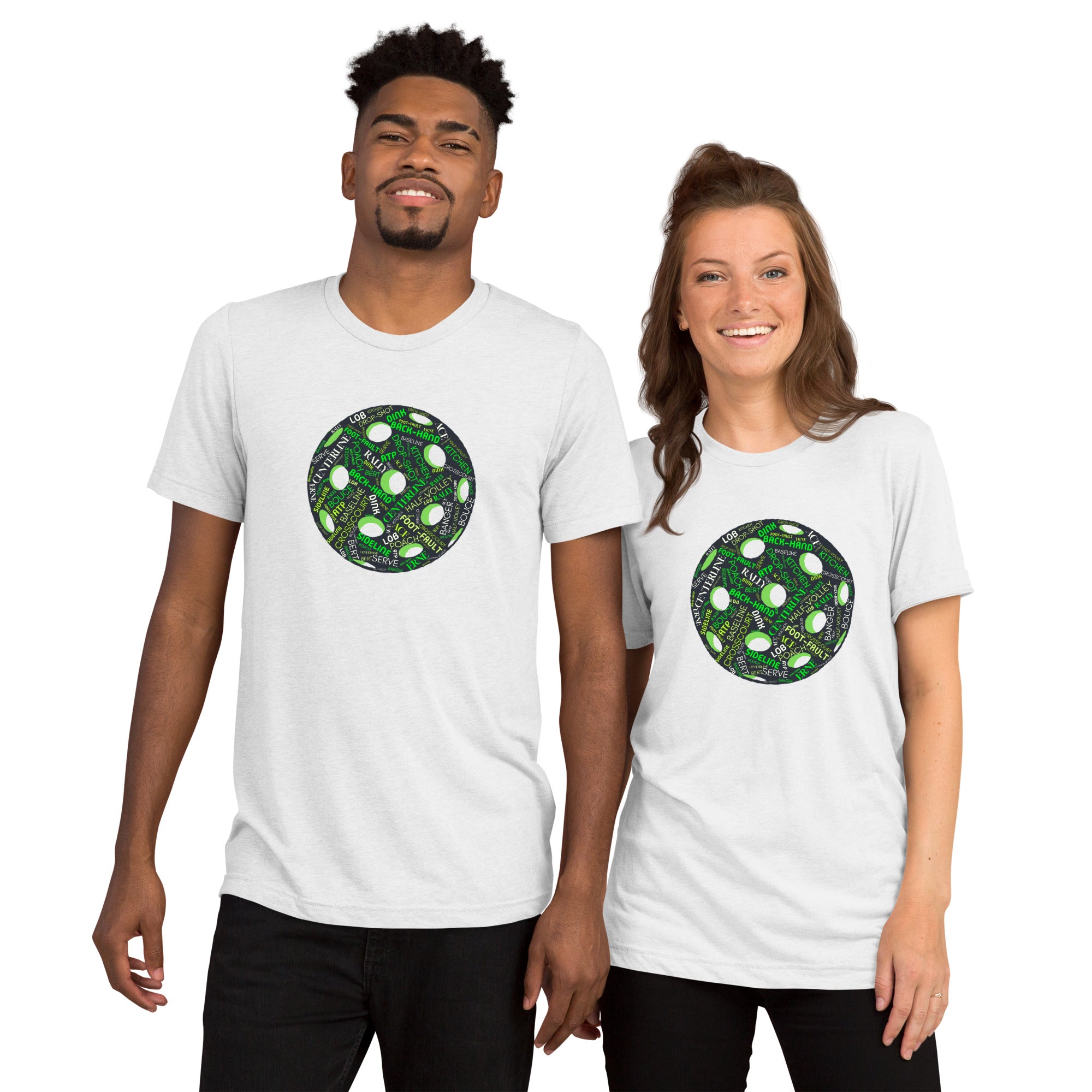 White unisex tri-blend T-shirt featuring a pickleball word cloud graphic with words like Dink, Pickle, and Kitchen.