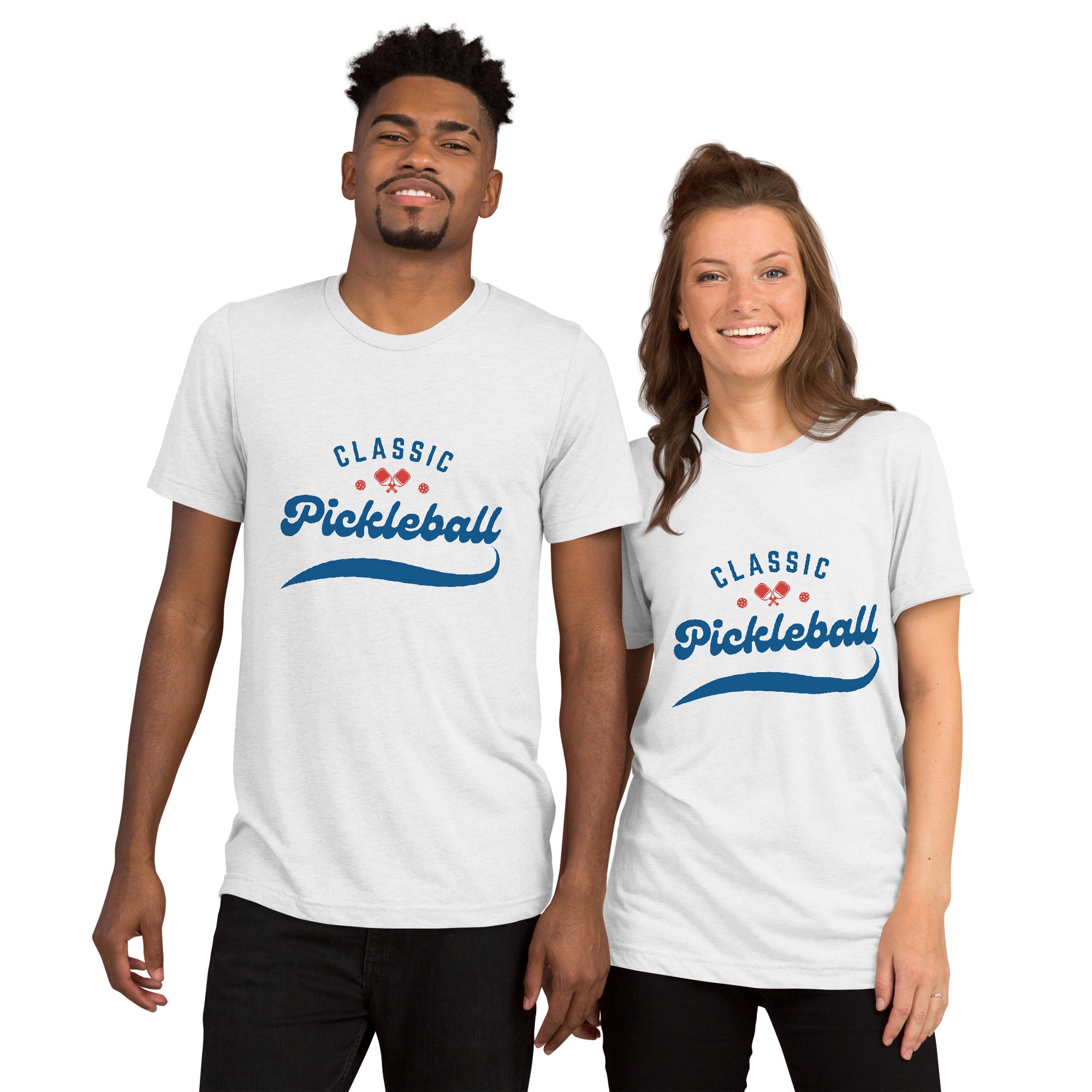 Unisex white tri-blend T-shirt with red and blue pickleball paddle and ball design, featuring the Classic Pickleball Script Tee logo.