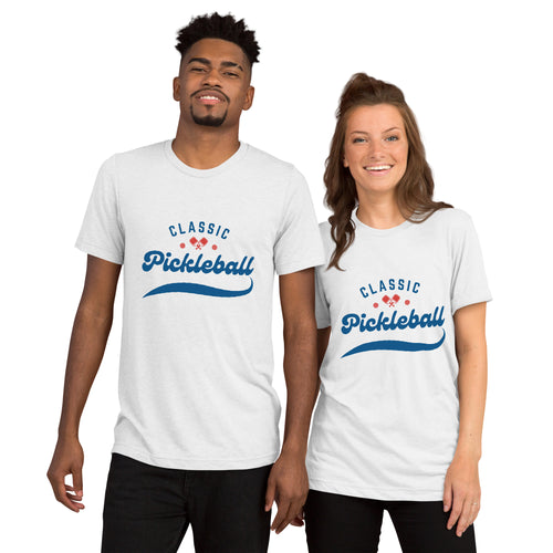 Unisex white tri-blend T-shirt with red and blue pickleball paddle and ball design, featuring the Classic Pickleball Script Tee logo.