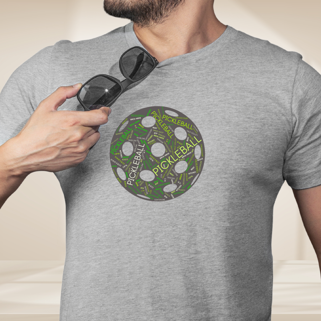 PeaMac Pickleball Tees graphic T-shirt featuring a colorful pickleball word cloud with terms like Dink, Pickle, and Kitchen.