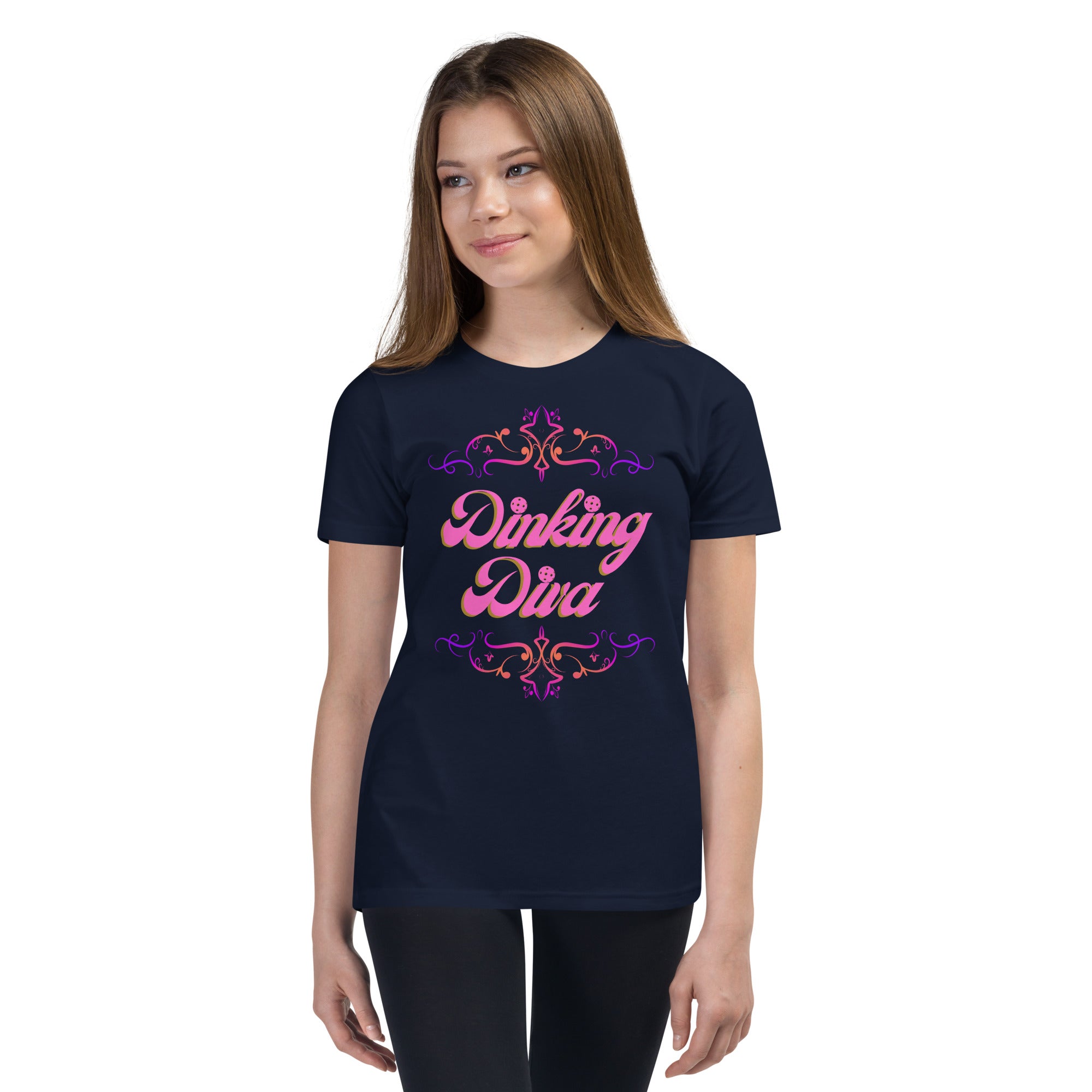 Pink filigree pickleball-themed youth tee by PeaMac Pickleball Tees, featuring a front design on kids' clothing.