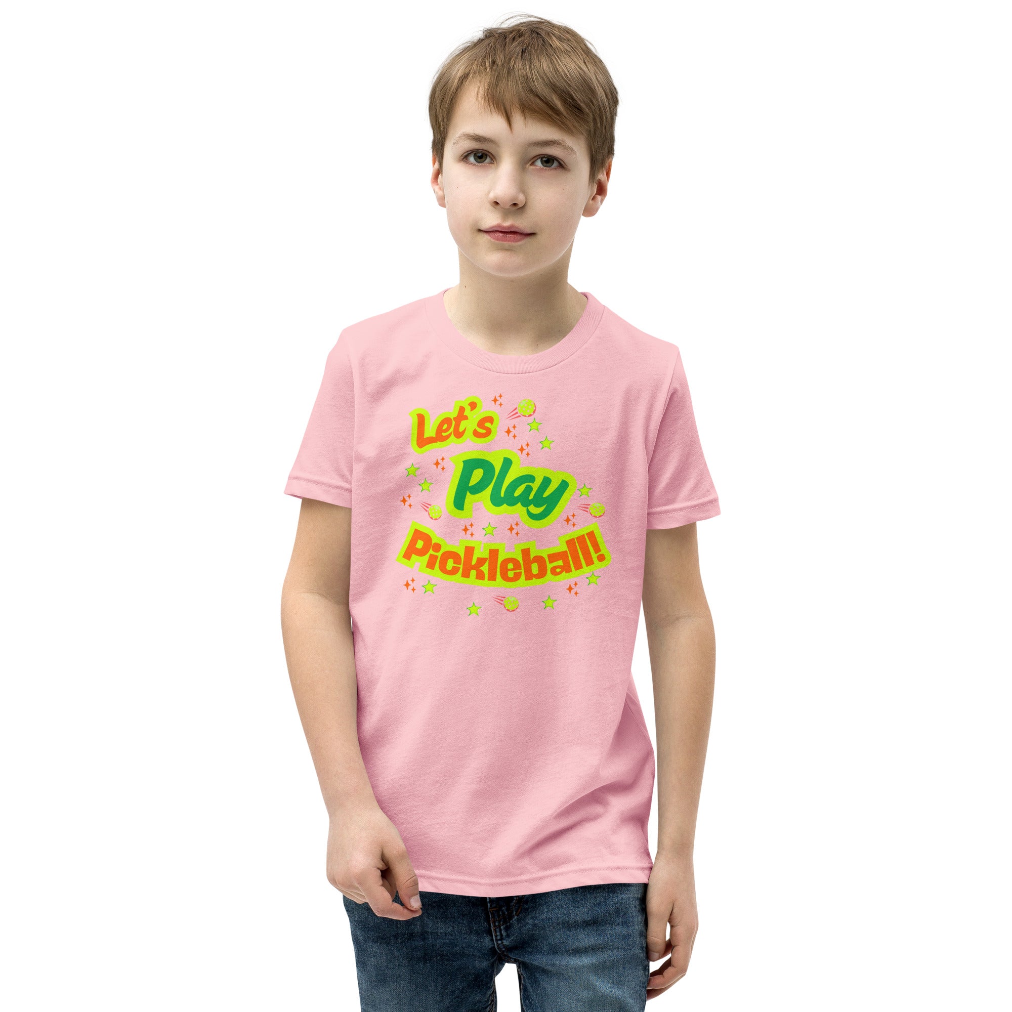 Pink youth T-shirt with neon pickleball graphic for kids, featuring "Let's Play Pickleball!" text, by PeaMac Pickleball Tees.