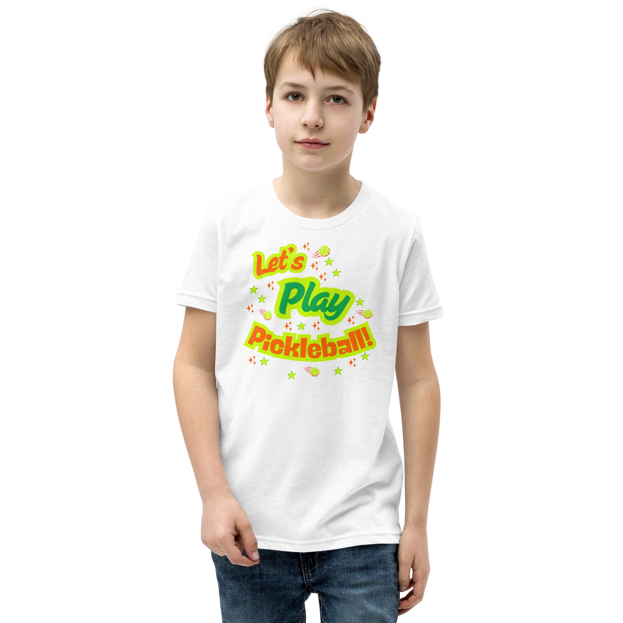 White youth T-shirt from PeaMac Pickleball Tees featuring a neon pickleball graphic, perfect for kids who love playing pickleball.